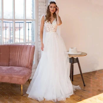 V-nyakú ujjatlan esküvői ruhák rátétes csipkével hát nélküli tüll A vonal 2023 Boho elegáns menyasszonyi ruhák Vestido De Noiva